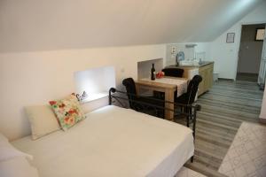 a living room with a couch and a table at Apartments Idila in Bela Crkva