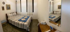 Cama ou camas em um quarto em Pousada Caminho do Vale Guiné