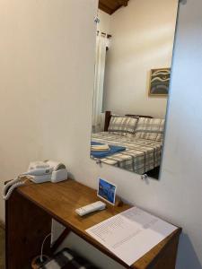 Cama ou camas em um quarto em Pousada Caminho do Vale Guiné