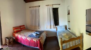Cama ou camas em um quarto em Pousada Caminho do Vale Guiné