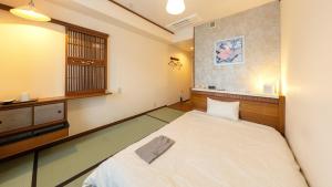 Hotel BELLMARE ホテルベルマーレ客房内的一张或多张床位