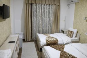 Postel nebo postele na pokoji v ubytování Hotel Ultra Star
