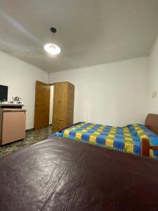 Postel nebo postele na pokoji v ubytování Departamento Pía II