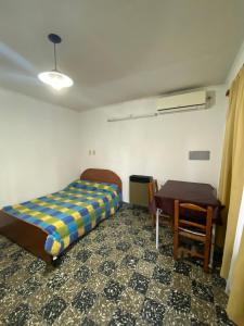 Postel nebo postele na pokoji v ubytování Departamento Pía II