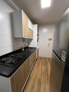 Køkken eller tekøkken på Apto aconchegante e lindo