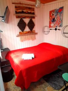 Postel nebo postele na pokoji v ubytování Hostal Newen