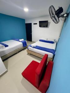Postel nebo postele na pokoji v ubytování Hotel Select Medellin