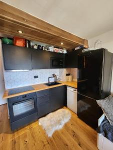 Kuchyň nebo kuchyňský kout v ubytování Cosy, plein centre vue splendide