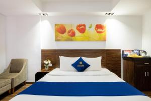 Postel nebo postele na pokoji v ubytování Sandals Lily Hotel