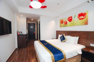 Postel nebo postele na pokoji v ubytování Sandals Lily Hotel