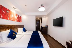 Postel nebo postele na pokoji v ubytování Sandals Lily Hotel
