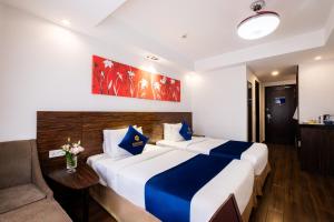Postel nebo postele na pokoji v ubytování Sandals Lily Hotel