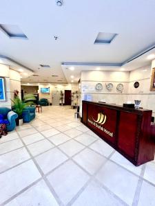 a lobby of a hospital with a reception desk at Knooz Aldiafah in Makkah