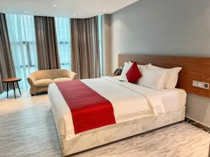 Postel nebo postele na pokoji v ubytování Hotel Omni Residency Baridhara + 22 fotografií