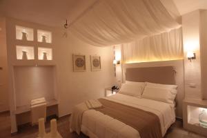 Letto o letti in una camera di Relais in Contrada