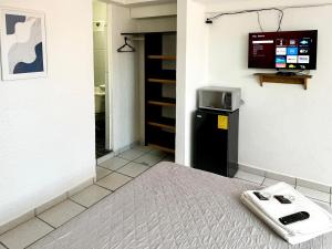 TV a/nebo společenská místnost v ubytování Departamentos H72