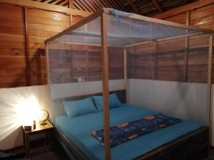 Postel nebo postele na pokoji v ubytování Amwaj Blue Cabana Arugambay