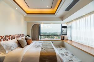 Postel nebo postele na pokoji v ubytování Guangzhou He She Art Apartment + 37 fotografií