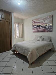 Ένα ή περισσότερα κρεβάτια σε δωμάτιο στο Alegría