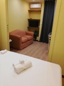 Postel nebo postele na pokoji v ubytování Candelieri Suites