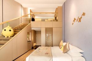 Letto o letti in una camera di 桂林桂花树下酒店 Guilin Osmanthus Tree Resort