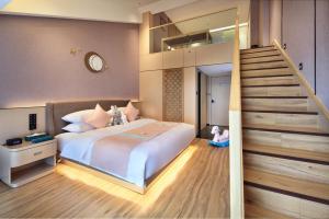 Letto o letti in una camera di 桂林桂花树下酒店 Guilin Osmanthus Tree Resort