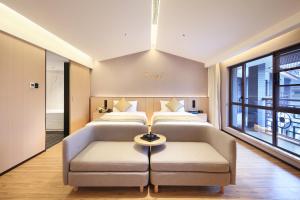 Letto o letti in una camera di 桂林桂花树下酒店 Guilin Osmanthus Tree Resort