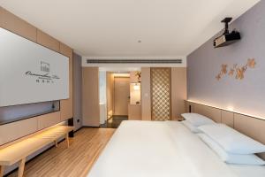 Letto o letti in una camera di 桂林桂花树下酒店 Guilin Osmanthus Tree Resort
