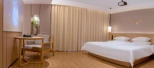 Letto o letti in una camera di 桂林桂花树下酒店 Guilin Osmanthus Tree Resort