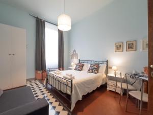 A bed or beds in a room at Affittacamere Firenze in Libertà Parterre