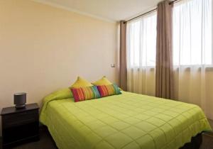Cama o camas de una habitación en Condominio Castilla