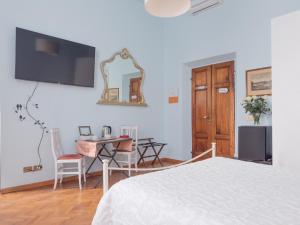 A bed or beds in a room at Affittacamere Firenze in Libertà Parterre
