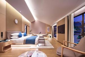 Letto o letti in una camera di 桂林桂花树下酒店 Guilin Osmanthus Tree Resort