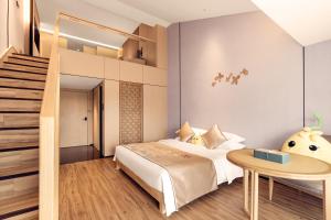 Letto o letti in una camera di 桂林桂花树下酒店 Guilin Osmanthus Tree Resort