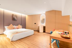Letto o letti in una camera di 桂林桂花树下酒店 Guilin Osmanthus Tree Resort
