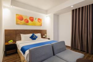 Postel nebo postele na pokoji v ubytování Sandals Lily Hotel