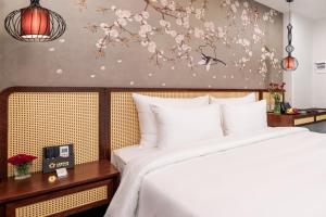 Voodi või voodid majutusasutuse Lestar Hotel Hanoi toas