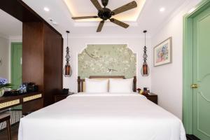 Voodi või voodid majutusasutuse Lestar Hotel Hanoi toas