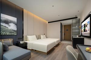 Postel nebo postele na pokoji v ubytování Atour Hotel Foshan Shunde Qinghuiyuan