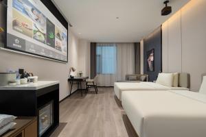 Postel nebo postele na pokoji v ubytování Atour Hotel Foshan Shunde Qinghuiyuan