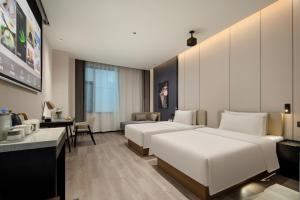 Postel nebo postele na pokoji v ubytování Atour Hotel Foshan Shunde Qinghuiyuan