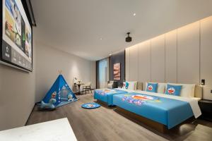 Postel nebo postele na pokoji v ubytování Atour Hotel Foshan Shunde Qinghuiyuan