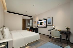 Postel nebo postele na pokoji v ubytování Atour Hotel Foshan Shunde Qinghuiyuan