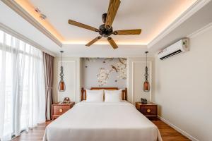 Voodi või voodid majutusasutuse Lestar Hotel Hanoi toas