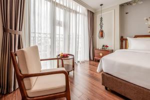 Voodi või voodid majutusasutuse Lestar Hotel Hanoi toas