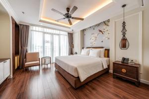 Voodi või voodid majutusasutuse Lestar Hotel Hanoi toas