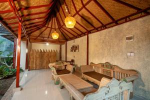 Posezení v ubytování Junna House Ubud by Prasi