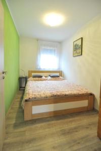 Postel nebo postele na pokoji v ubytování M&M apartments