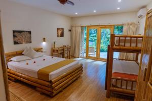 Voodi või voodid majutusasutuse Ecoboo Maldives toas