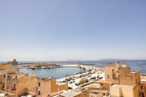 a view of a city with buildings and a harbor at La Piazzetta Del Tramonto Vista Mare In Centro in Trapani